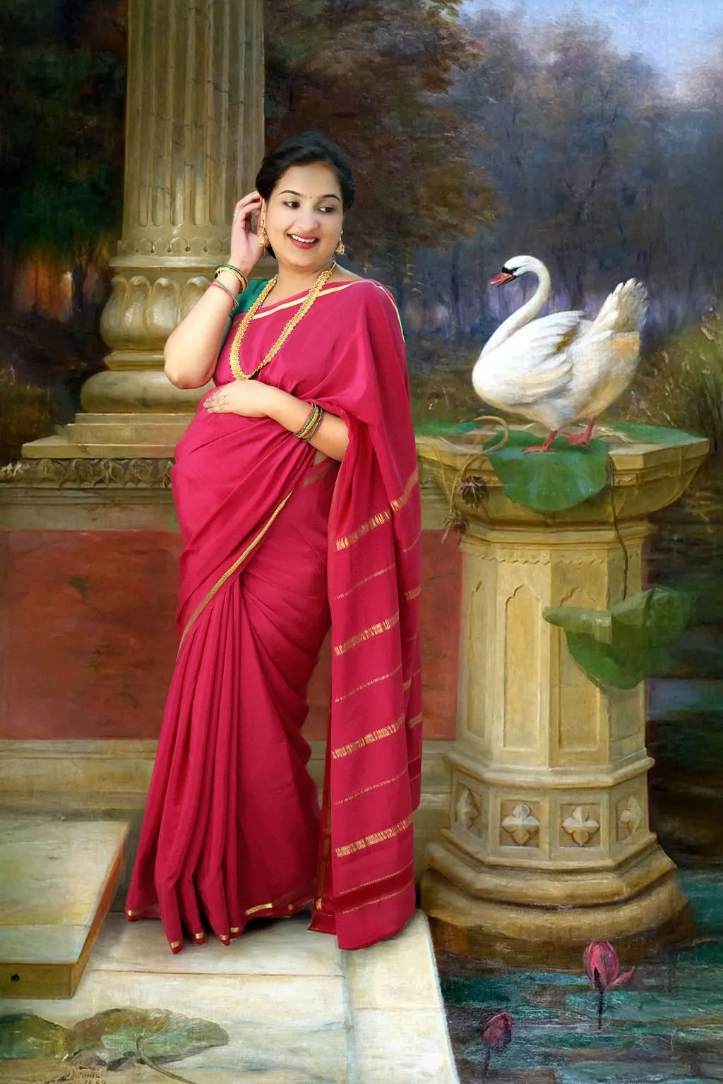 Laughing expectant mother in a pink saree by a painted pillar and swan backdrop, maternity photoshoot at WonderBump Studio, Bengaluru