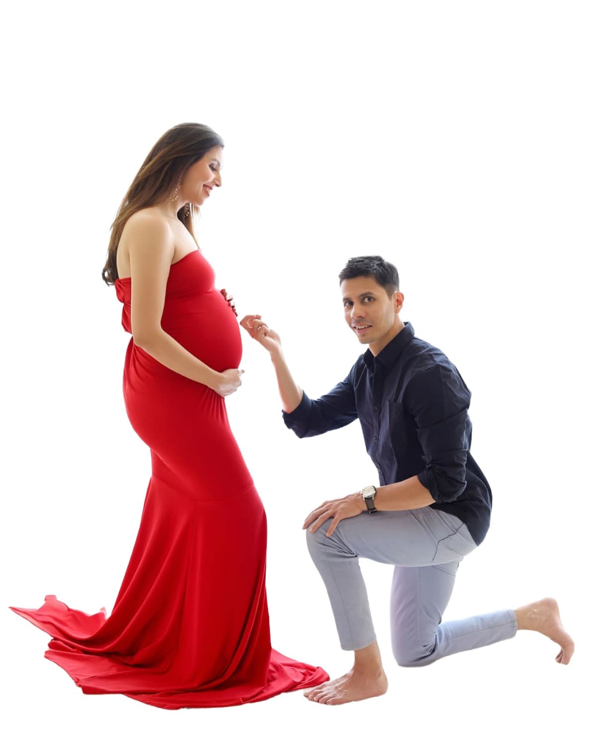 An expecting couple sharing a quiet moment in a maternity portrait at WonderBump Studio, Bengaluru.